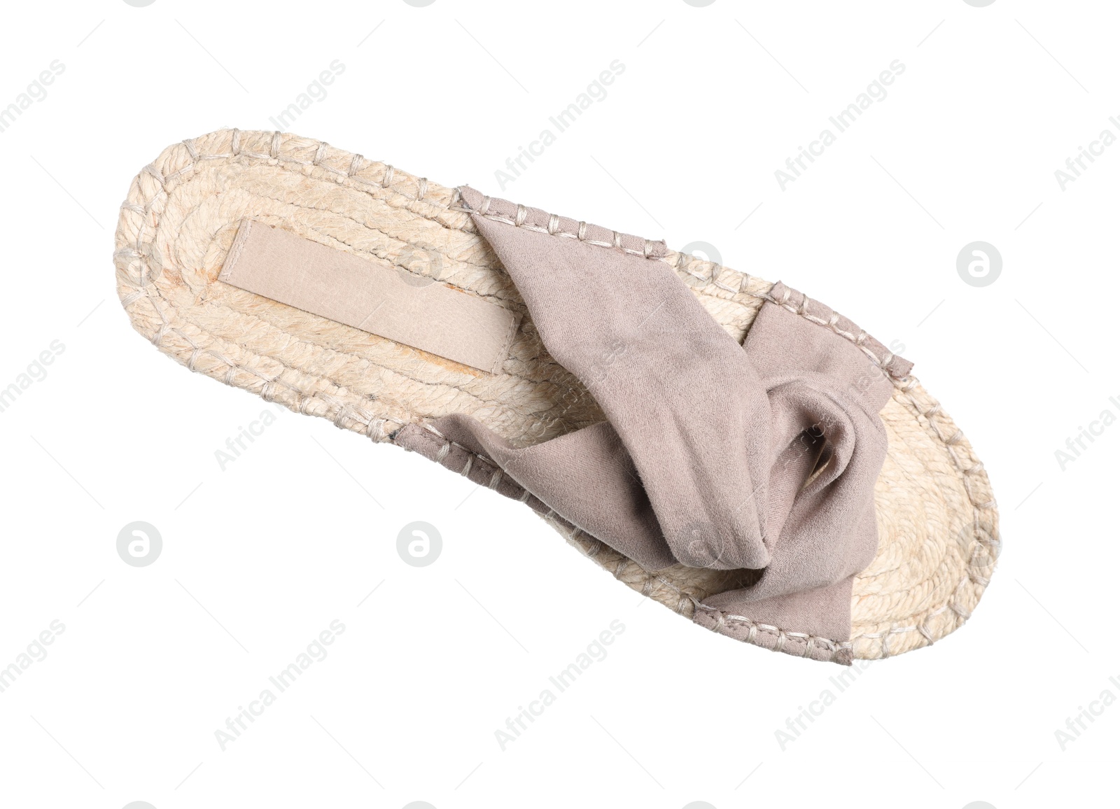 Photo of One stylish slipper in air isolated on white