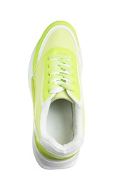 Photo of One green sneaker in air isolated on white