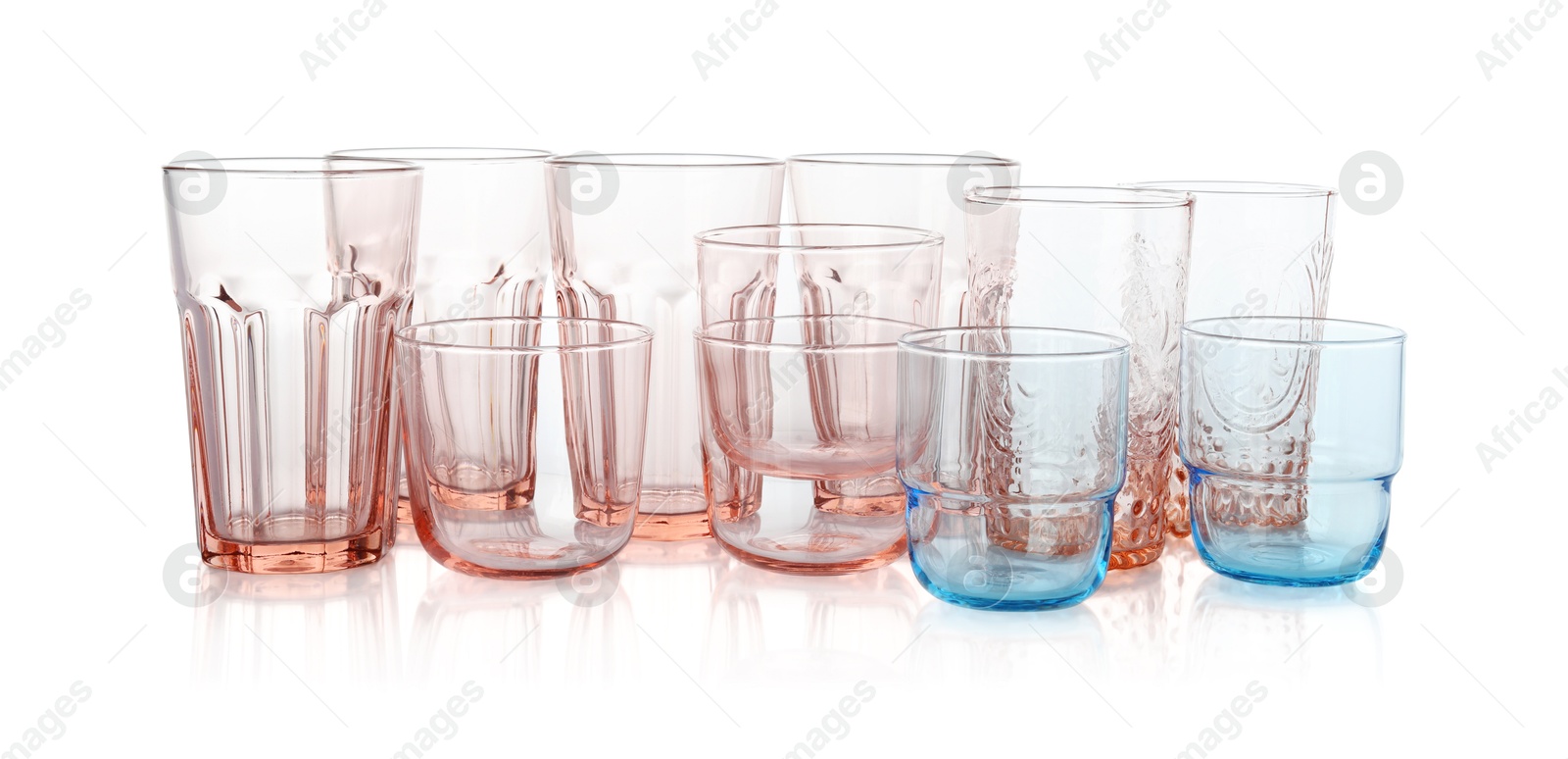 Photo of Many empty clean glasses isolated on white