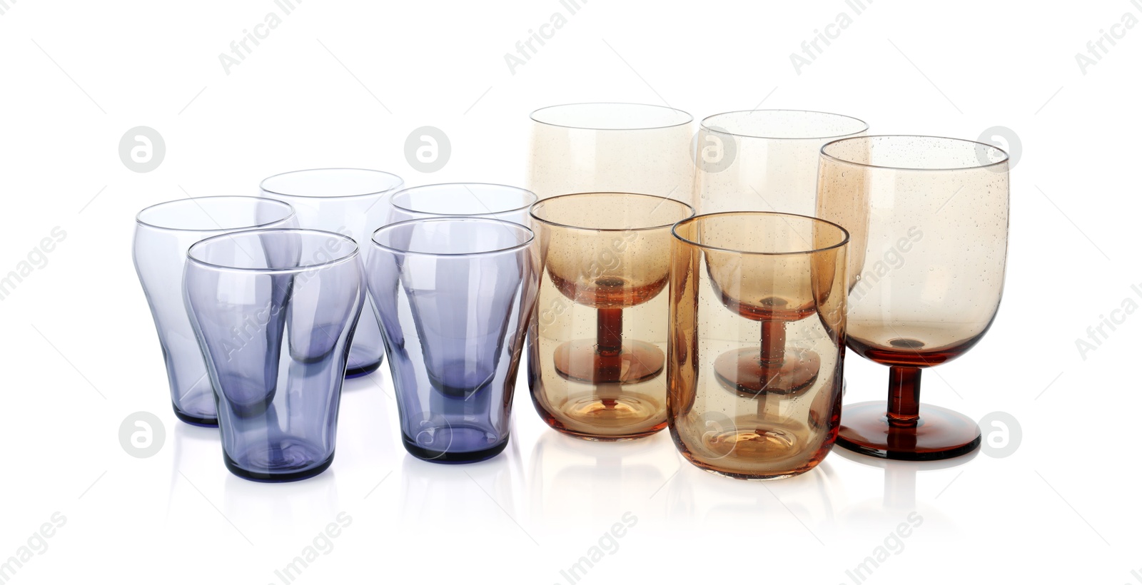 Photo of Many empty clean glasses isolated on white