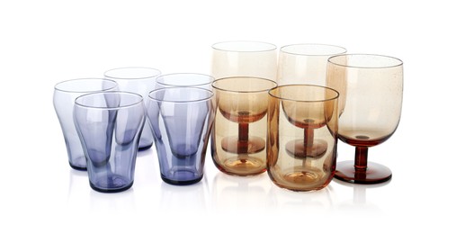 Photo of Many empty clean glasses isolated on white