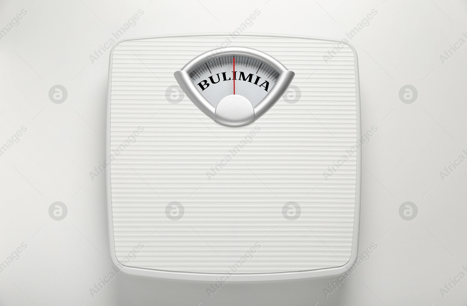 Image of Mechanical scales with word Bulimia instead of numbers on white background, top view