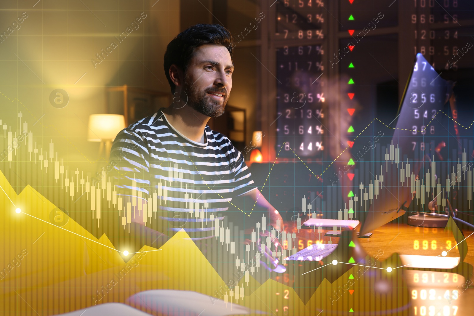 Image of Man working in room at night, double exposure with data and graphs. Trading