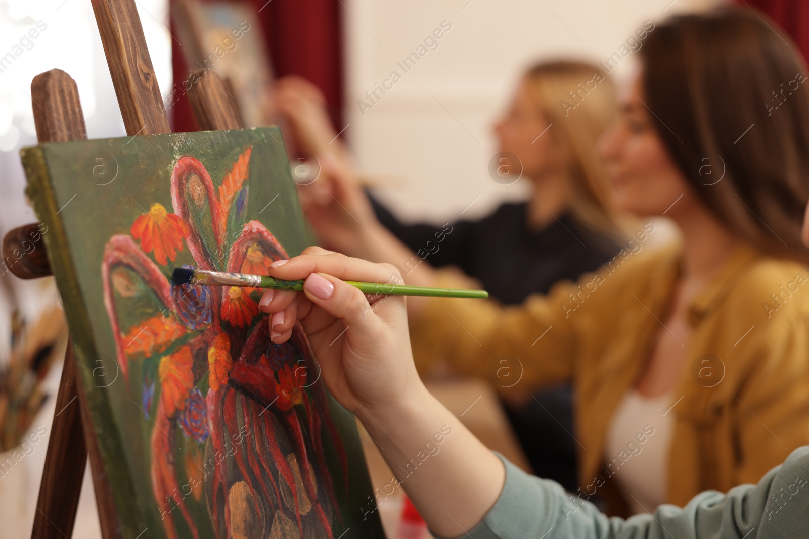 Photo of Women learning to draw in class, closeup