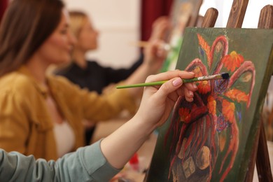 Photo of Women learning to draw in class, closeup