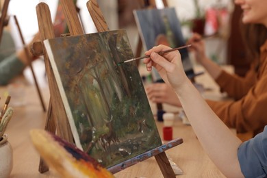 Photo of Woman learning to draw at table in class, closeup