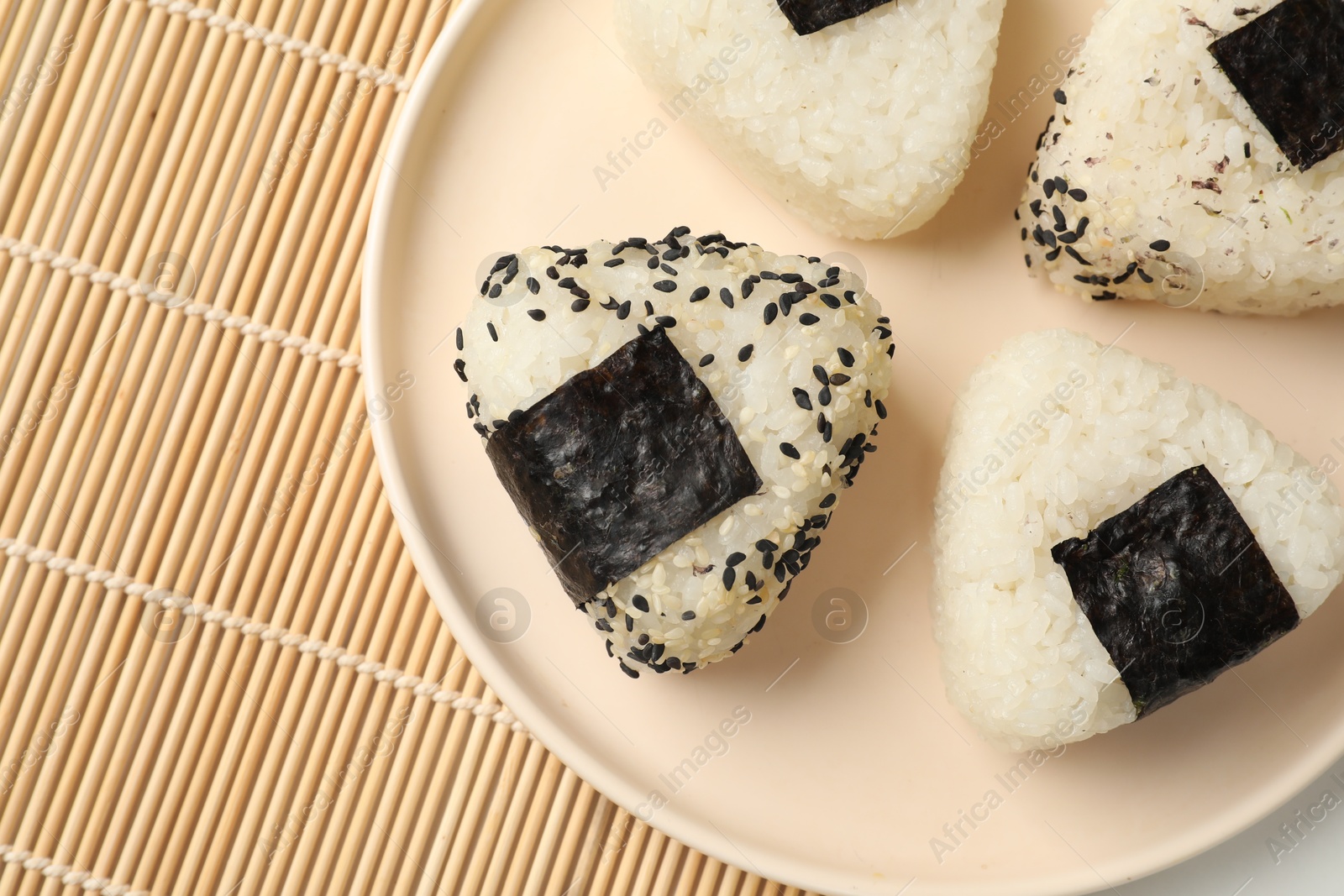 Photo of Rice balls (onigiri) on table, top view. Traditional Japanese dish