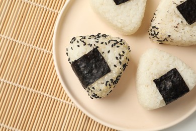 Photo of Rice balls (onigiri) on table, top view. Traditional Japanese dish