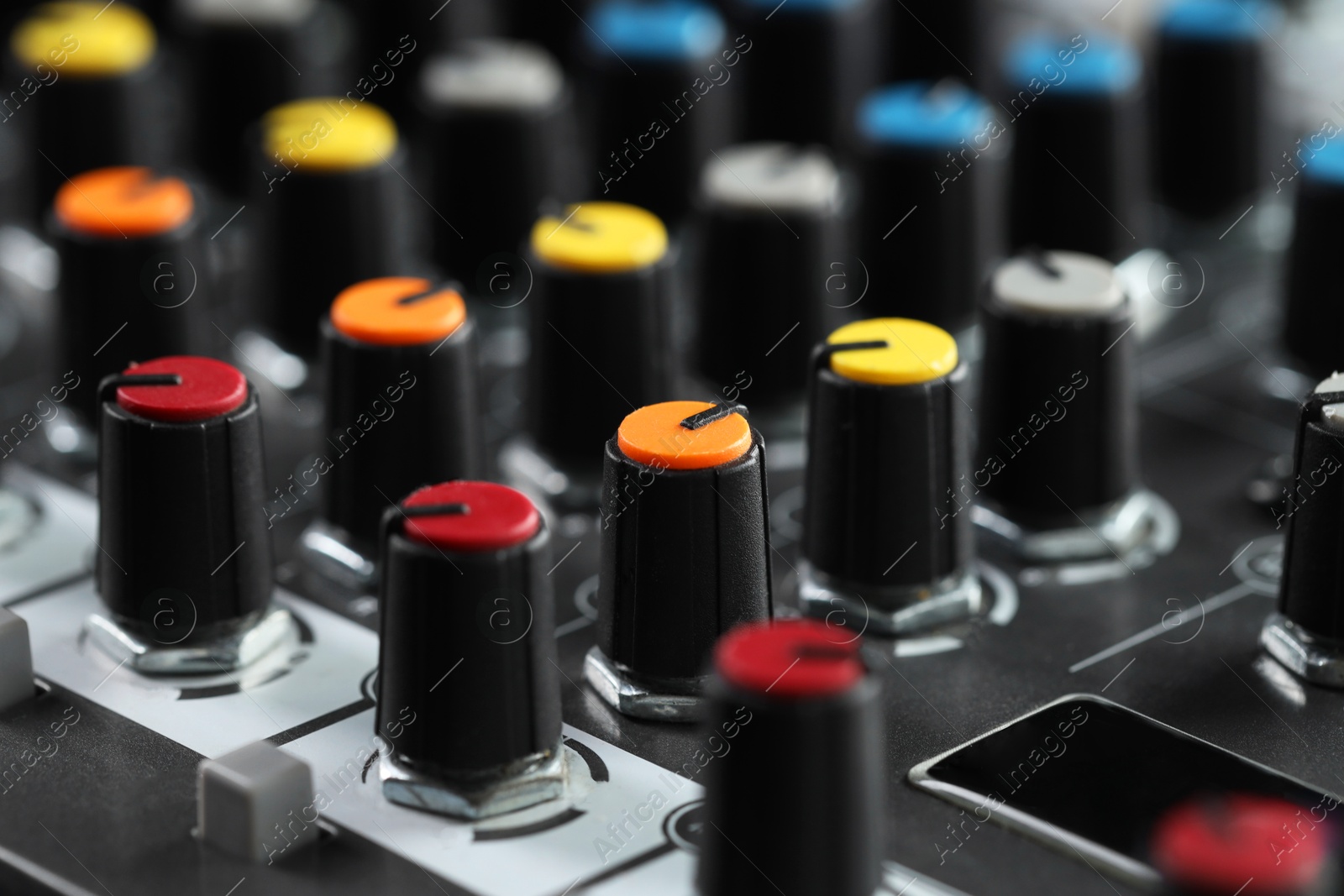 Photo of Professional mixing console, closeup. Radio studio equipment