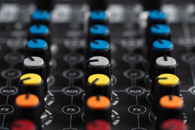 Photo of Professional mixing console, closeup. Radio studio equipment