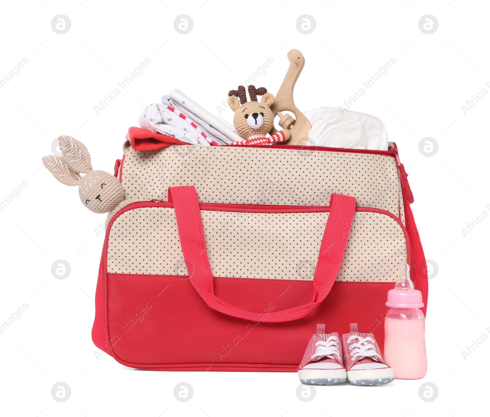 Photo of Mother's bag with baby's stuff isolated on white