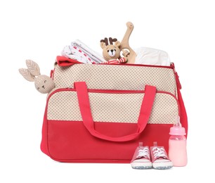 Photo of Mother's bag with baby's stuff isolated on white