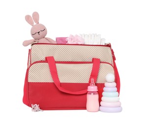 Photo of Mother's bag with baby's stuff isolated on white