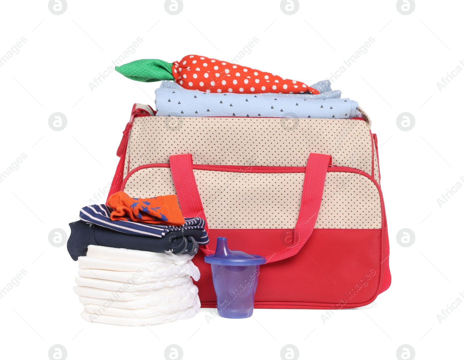 Photo of Mother's bag with baby's stuff isolated on white