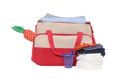 Photo of Mother's bag with baby's stuff isolated on white