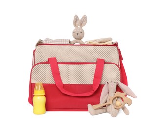 Photo of Mother's bag with baby's stuff isolated on white