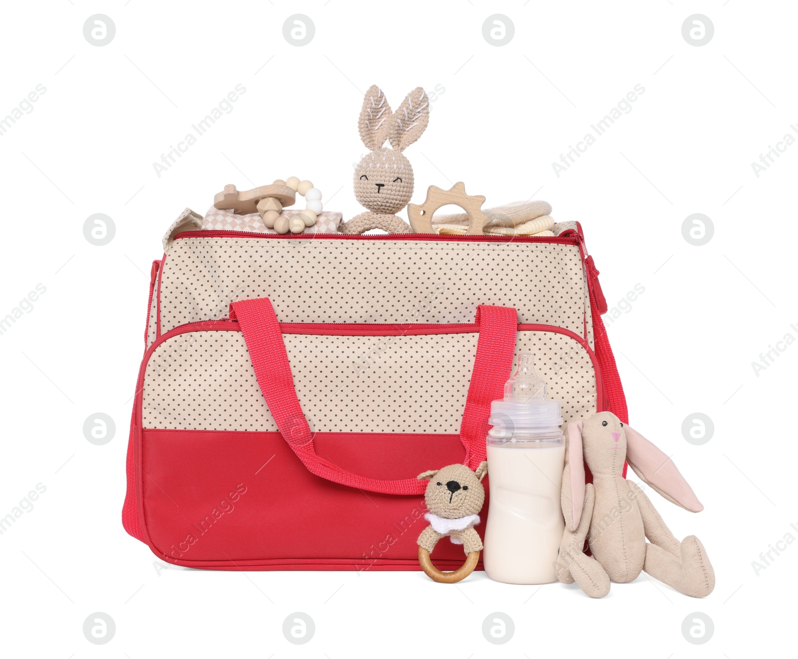 Photo of Mother's bag with baby's stuff isolated on white