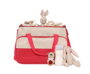 Photo of Mother's bag with baby's stuff isolated on white