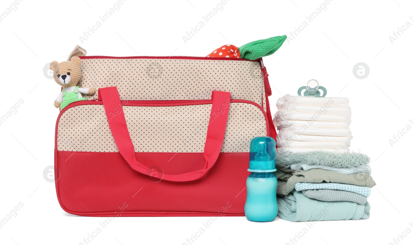 Photo of Mother's bag with baby's stuff isolated on white