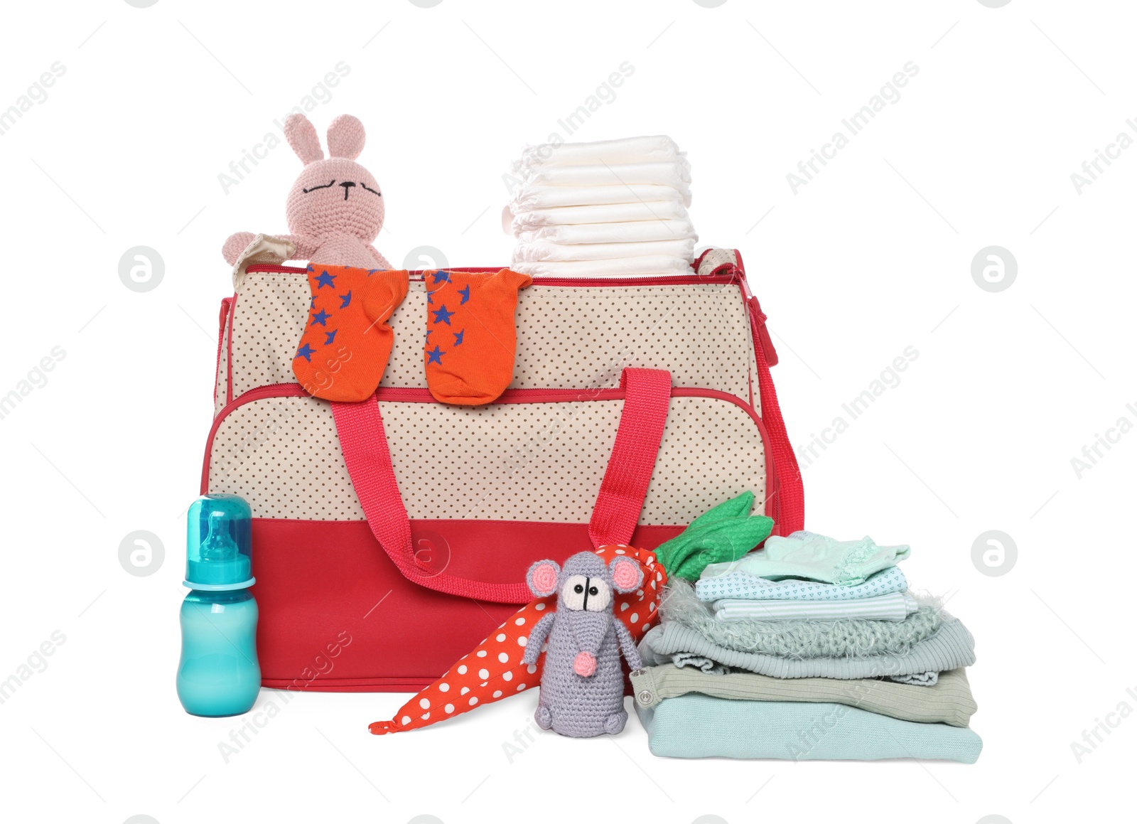 Photo of Mother's bag with baby's stuff isolated on white