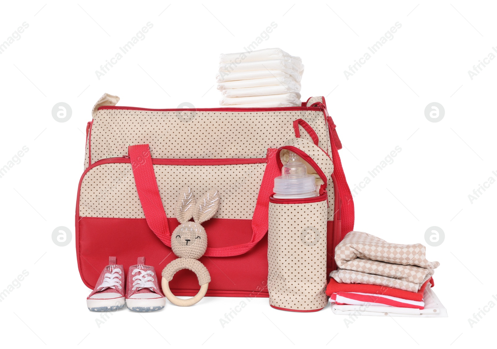 Photo of Mother's bag with baby's stuff isolated on white