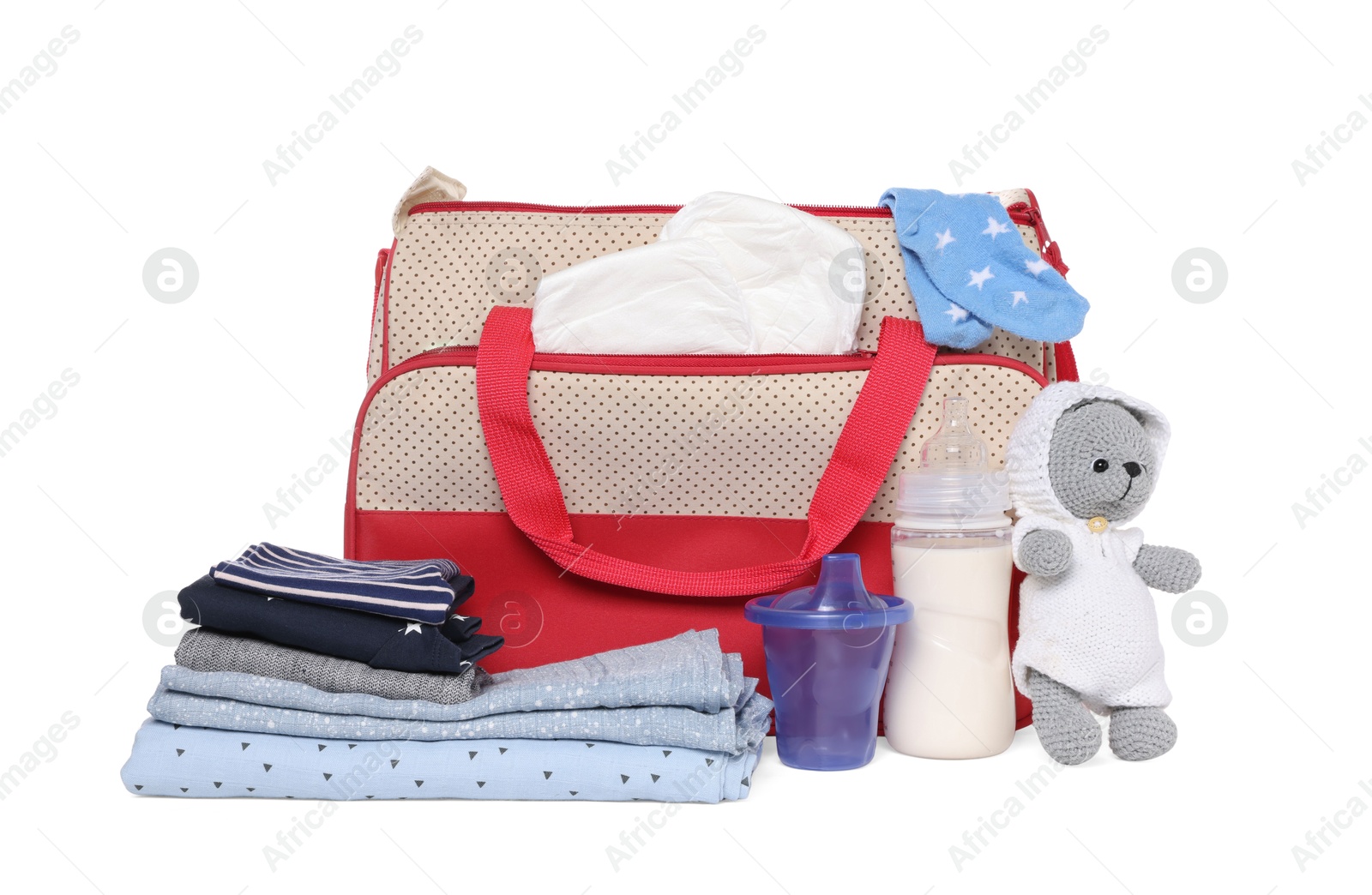 Photo of Mother's bag with baby's stuff isolated on white