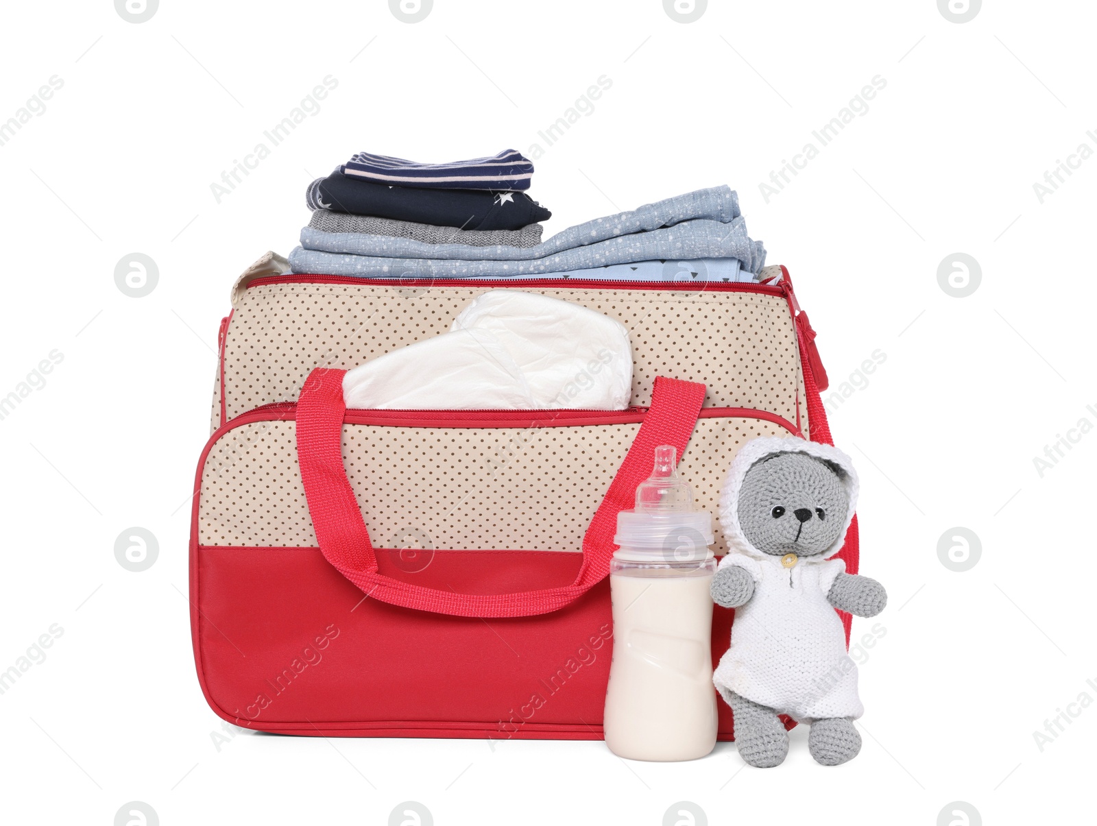 Photo of Mother's bag with baby's stuff isolated on white