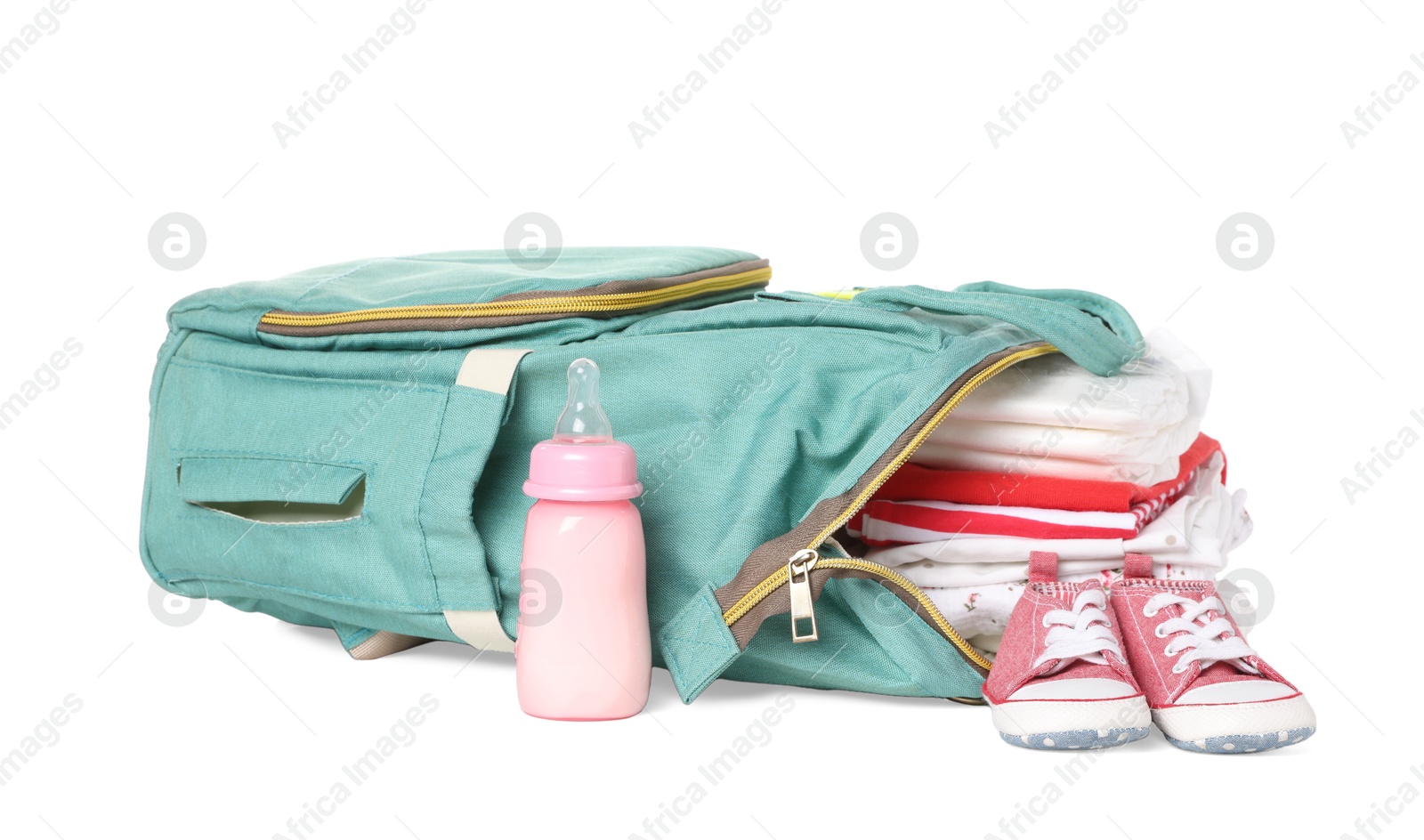 Photo of Mother's bag with baby's stuff isolated on white