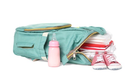 Photo of Mother's bag with baby's stuff isolated on white