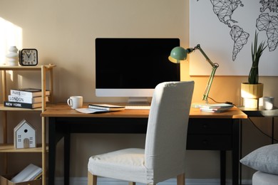 Photo of Comfortable workplace with modern computer in home office