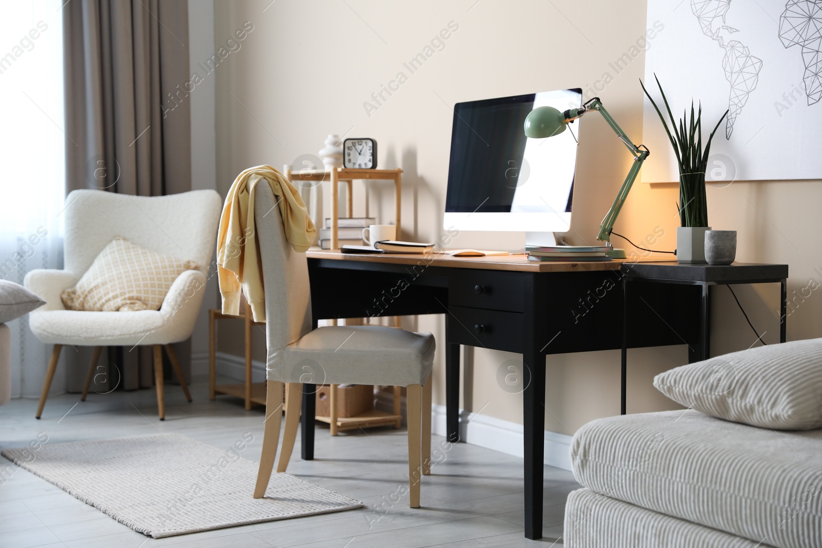 Photo of Comfortable workplace with modern computer in home office