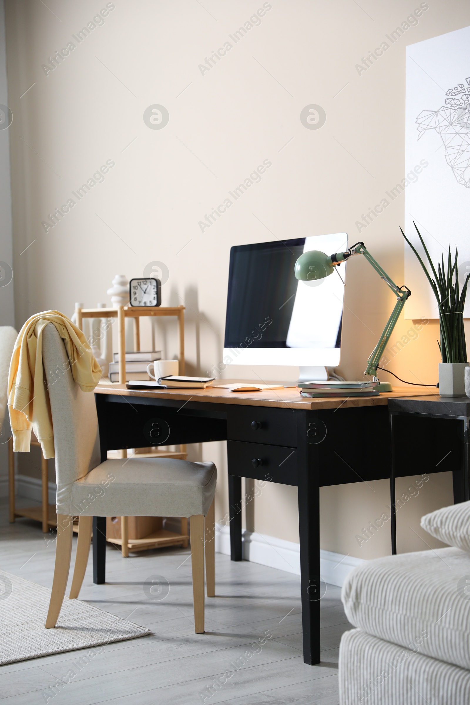 Photo of Comfortable workplace with modern computer in home office