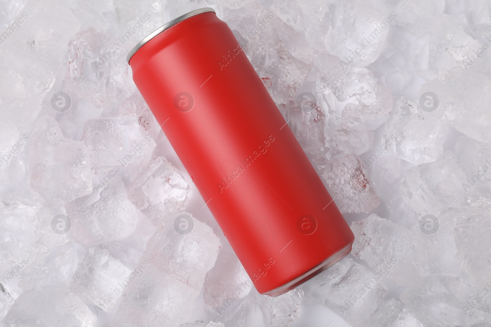 Refreshing drink in can on ice cubes, top view Photo of Refreshing drink in can on ice cubes, top view
