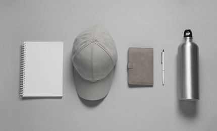 Photo of Different blank items for branding on gray background, flat lay. Mockup for design