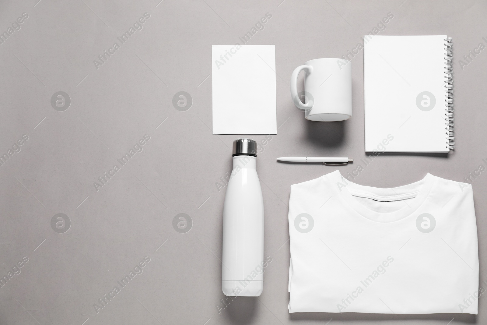 Photo of Different blank items for branding on grey background, flat lay. Mockup for design