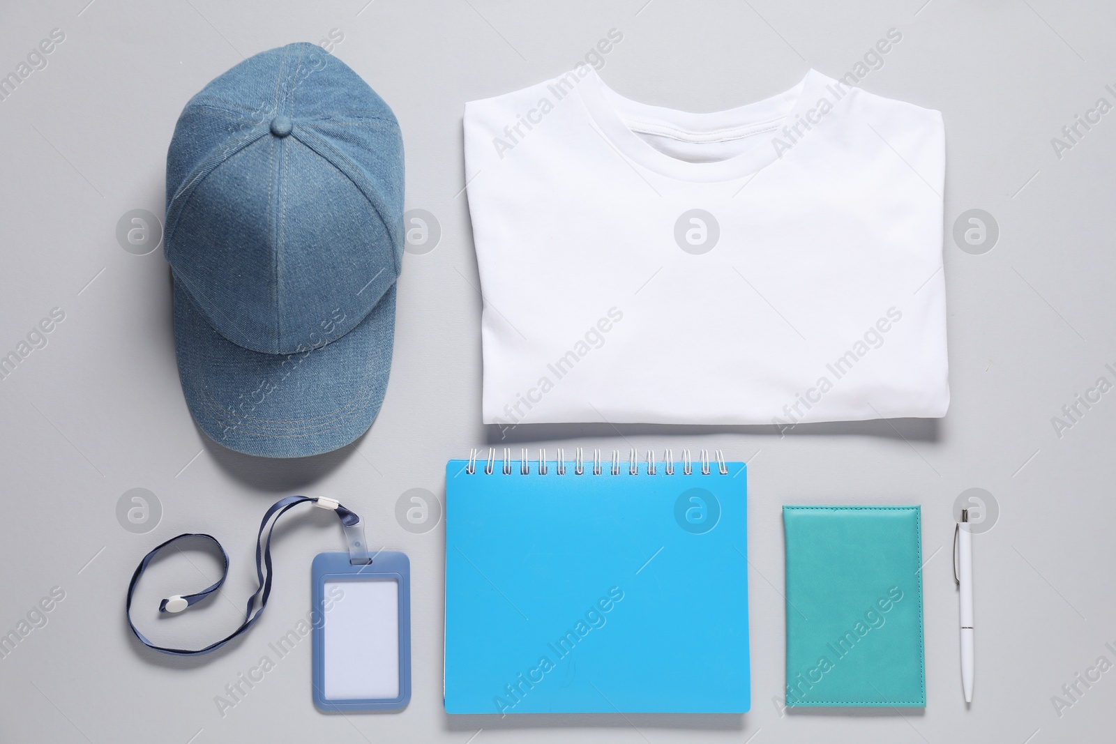 Photo of Different blank items for branding on grey background, flat lay. Mockup for design