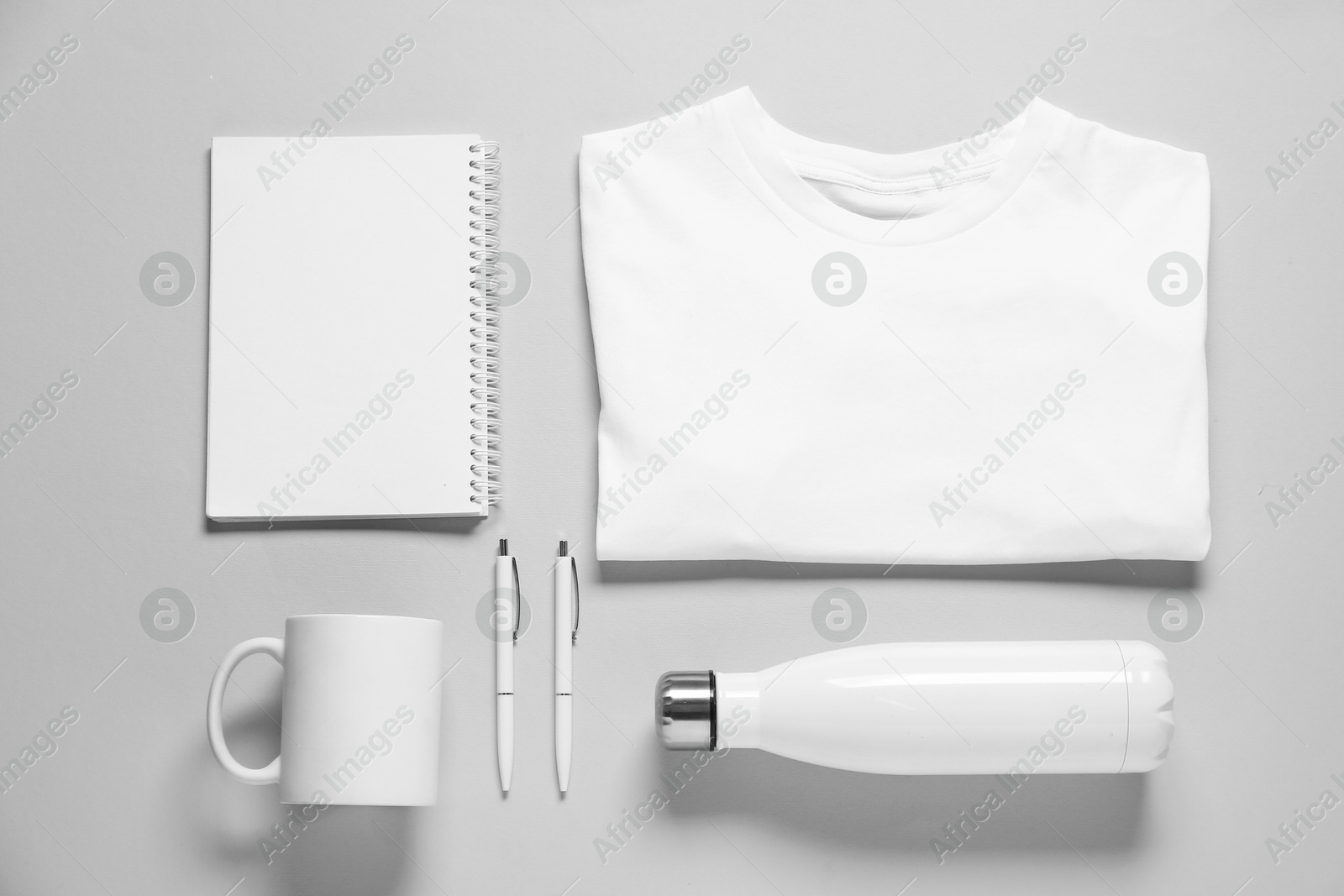 Photo of Different blank items for branding on grey background, flat lay. Mockup for design