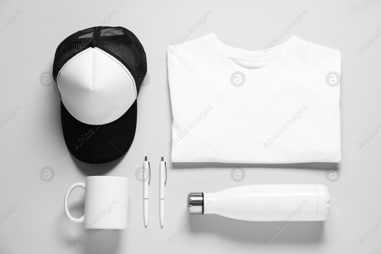 Photo of Different blank items for branding on grey background, flat lay. Mockup for design