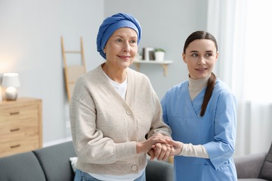 Photo of Nurse supporting woman with cancer at home