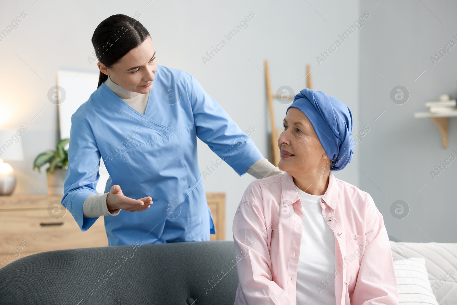 Photo of Woman with cancer and nurse at home