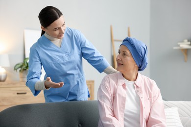 Photo of Woman with cancer and nurse at home