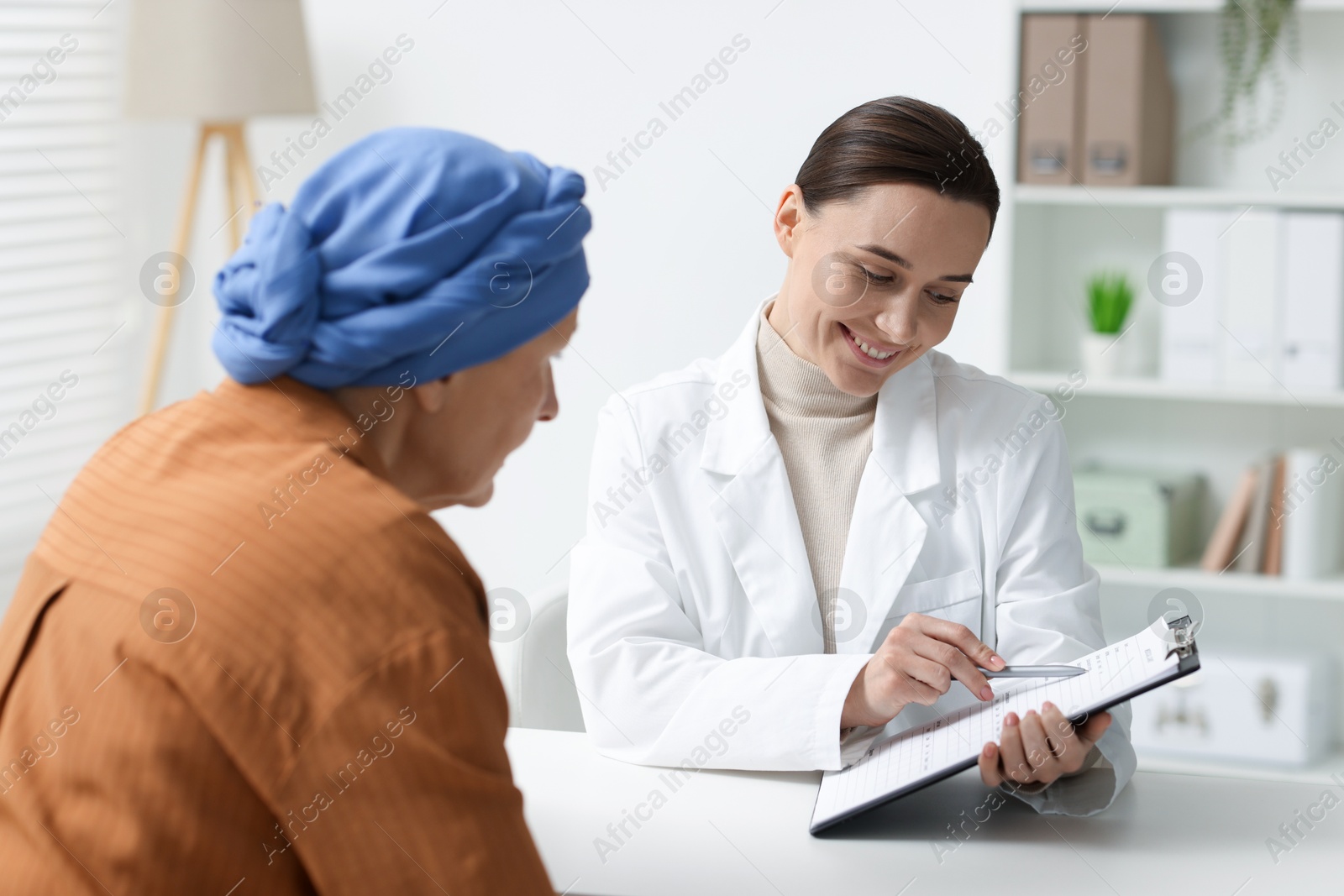 Photo of Senior woman with cancer visiting oncologist in clinic