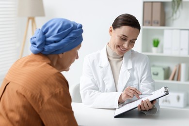 Photo of Senior woman with cancer visiting oncologist in clinic