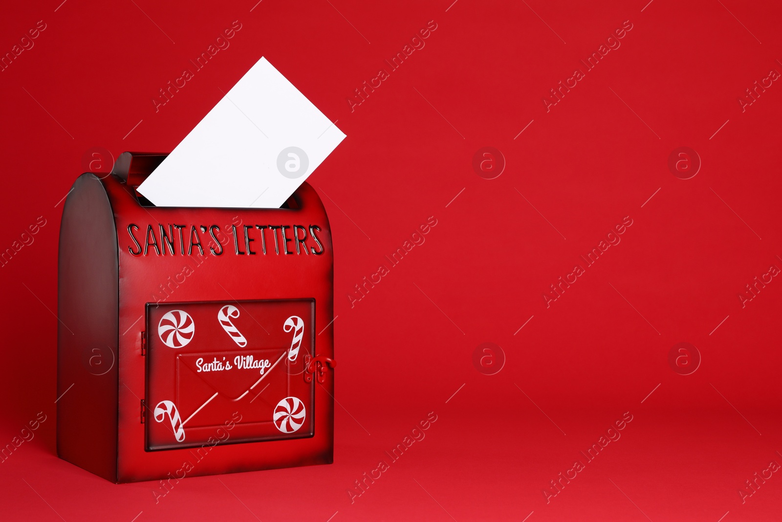 Photo of Santa Claus mailbox with letter on red background, space for text. Christmas tradition