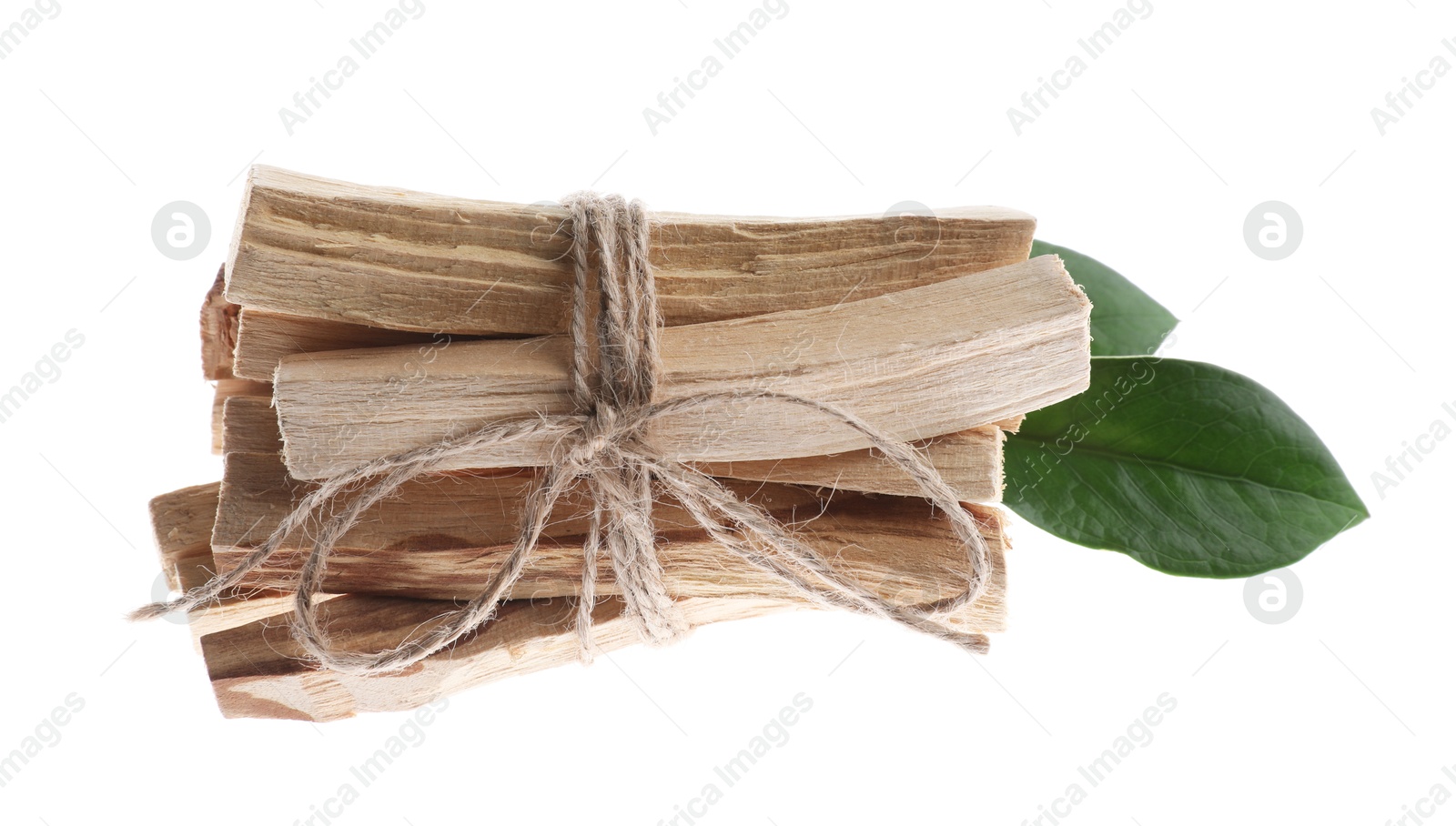 Photo of Palo santo sticks and green leaves on white background