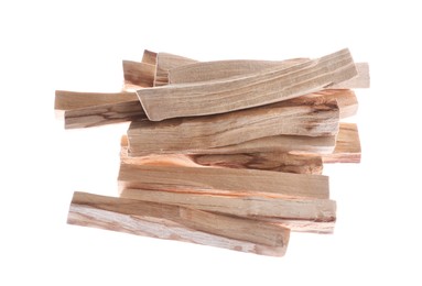 Photo of Pile of palo santo sticks on white background