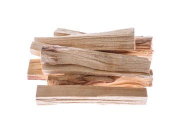 Photo of Pile of palo santo sticks on white background