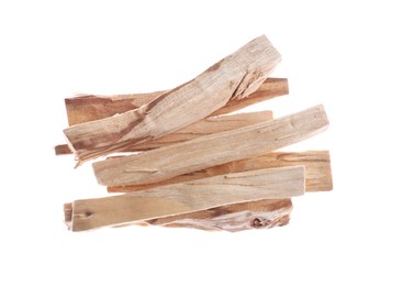 Photo of Pile of palo santo sticks in air on white background, top view