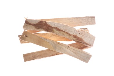 Photo of Pile of palo santo sticks in air on white background, top view