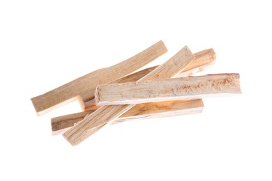 Photo of Pile of palo santo sticks on white background, above view